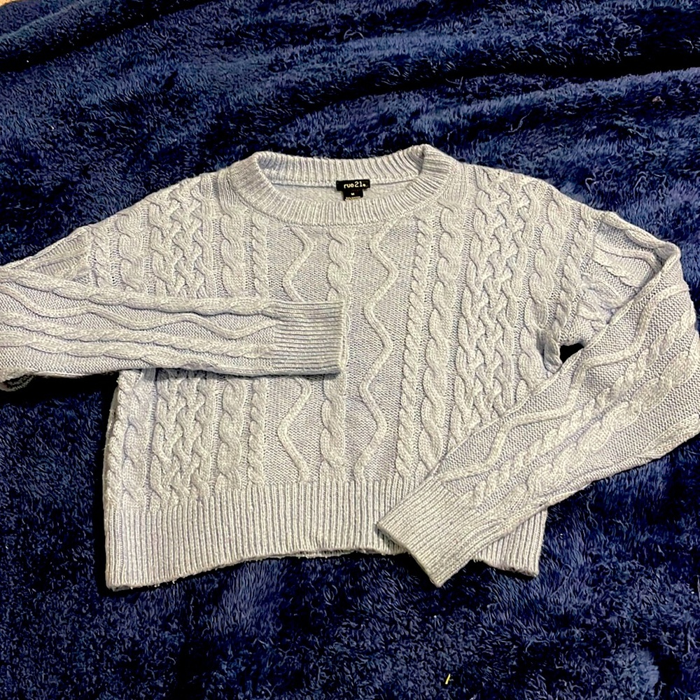 Cropped light blue sweater.